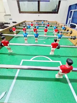 a group of dolls playing a table tennis game at Santorini 4 Bedrooms Full Air Cond Entire Home by Grab A Stay in Ipoh