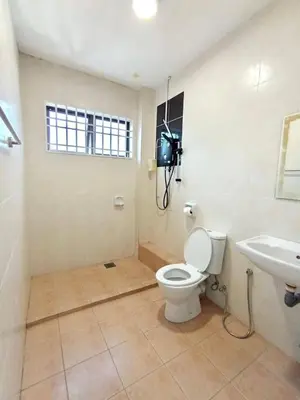 a bathroom with a toilet and a sink at Santorini 4 Bedrooms Full Air Cond Entire Home by Grab A Stay in Ipoh