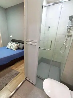 a bathroom with a shower with a glass door at Octagon Premium Ipoh Town Center 2BR 101 by Grab A Stay in Ipoh