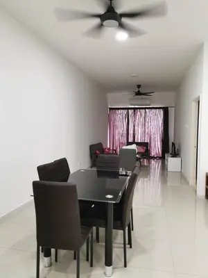 a dining room with a black table and chairs at Taiping Comfort Condo Homestay in Taiping