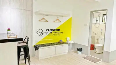a bathroom with a yellow sign on the wall at Pangkor Better Life Cozy Studio-walking 2min to beach,1-4pax in Pangkor
