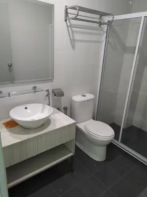 a bathroom with a toilet and a sink and a shower at Marina Couple Home Stay, No Counter reception, please look details in Lumut