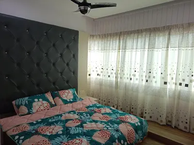 a bedroom with a large bed and a window at Best Sekinchan homestay in Sekincan
