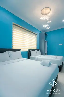 two beds in a room with blue walls at Ipoh MJ Boutique House by Verve (20pax) EECH79 in Ipoh
