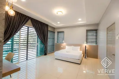 a bedroom with a bed and a desk and windows at Ipoh MJ Boutique House by Verve (20pax) EECH79 in Ipoh