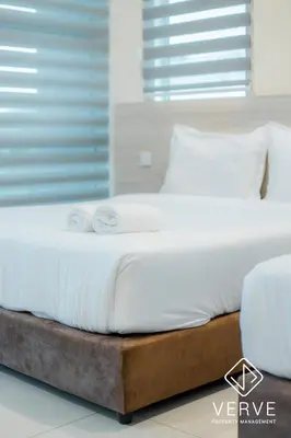 a bed with two white pillows on top of it at Ipoh MJ Boutique House by Verve (20pax) EECH79 in Ipoh