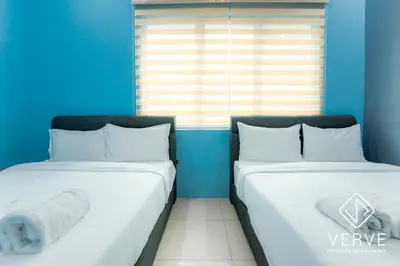 two beds in a room with blue walls at Ipoh MJ Boutique House by Verve (20pax) EECH79 in Ipoh
