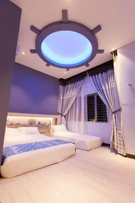 a bedroom with two beds and a large blue light at Pearl Rice Garden \uff08cottage style\uff09\u7c73\u6a02\u574a\u9802\u5c64\u7530\u56ed\u5f0f\u9ad8\u7ea7\u516c\u5bd3 in Sekincan