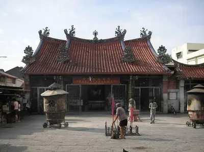 a person standing in front of a building at UNESCO Bohemian Style Heritage House at Georgetown 5BR 14 pax in George Town