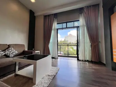 a living room with a couch and a large window at Hotel Studio Apartment- Fantastic Mountain View (4pax) in Brinchang