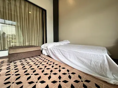 a bedroom with a bed and a window at Hotel Studio Apartment- Fantastic Mountain View (4pax) in Brinchang