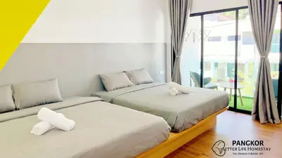 two beds sitting next to each other in a bedroom at Pangkor Better Life Minimalist Beach Villa-13 to15pax Free WiFi in Pangkor