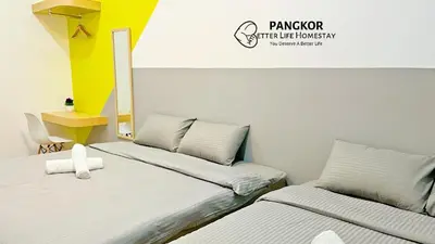 a room with two beds and a yellow and white at Pangkor Better Life Minimalist Beach Villa-13 to15pax Free WiFi in Pangkor