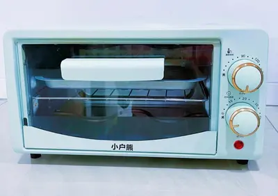 a white toaster oven with a paper inside at Pangkor Better Life Minimalist Beach Villa-13 to15pax Free WiFi in Pangkor