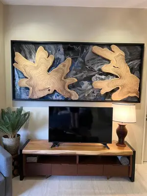 a living room with a tv and a table at By The Sea Beachfront Designer Suites Penang - Managed by Art of Tree in Batu Ferringhi
