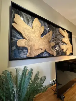 two wooden cutting boards on a wall with a painting at By The Sea Beachfront Designer Suites Penang - Managed by Art of Tree in Batu Ferringhi