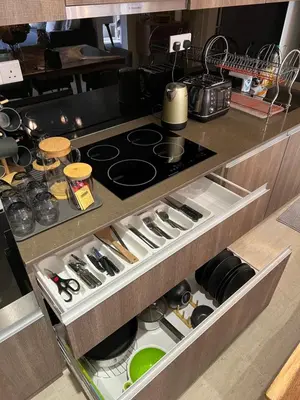a kitchen drawer with a stove top in it at By The Sea Beachfront Designer Suites Penang - Managed by Art of Tree in Batu Ferringhi