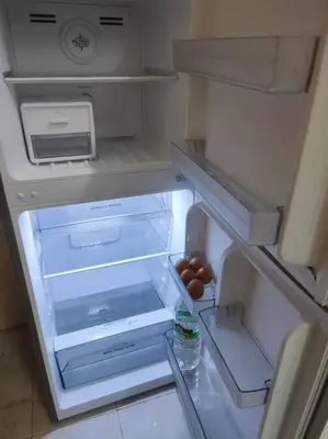 a refrigerator with its door open with eggs in it at Mai KKB Homestay in Kuala Kubu Bharu Taman Juta in Kuala Kubu Baharu