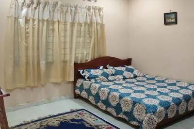 a bedroom with a bed and a window at Mai KKB Homestay in Kuala Kubu Bharu Taman Juta in Kuala Kubu Baharu