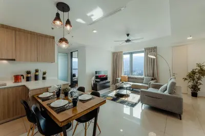 a kitchen and living room with a table and chairs at SOPHIA'S HOME - CITY and HILL VIEW 3BR at 218 Tropicana Macalister with Netflix & TV Box in George Town