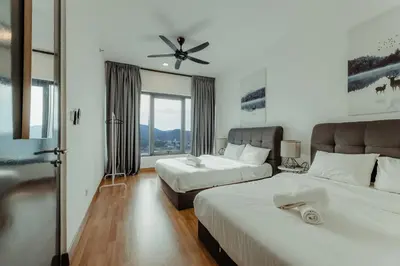 a bedroom with two beds and a ceiling fan at SOPHIA'S HOME - CITY and HILL VIEW 3BR at 218 Tropicana Macalister with Netflix & TV Box in George Town