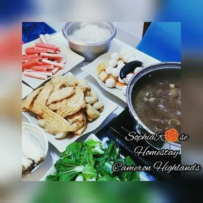 a table topped with food and a bowl of soup at Muslim Boutique Apartment with Balcony in Tanah Rata