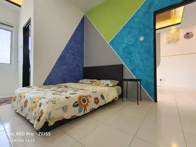 a bedroom with a bed with a colorful wall at ifloral CH1 in Tanah Rata