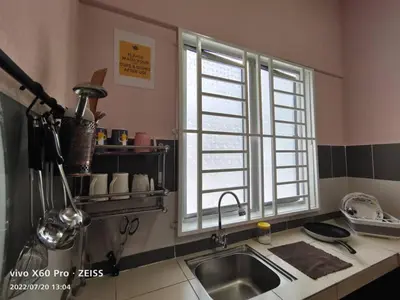 a kitchen with a sink and a window at ifloral CH1 in Tanah Rata