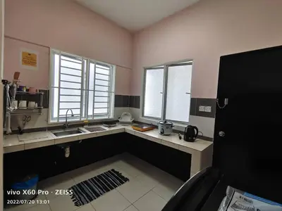a kitchen with a sink and two windows at ifloral CH1 in Tanah Rata