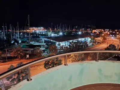 a view of a harbor at night with a marina at Glossy Marina Homestays in Lumut