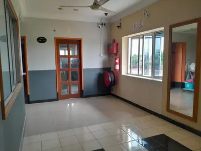 an empty room with a door and a window at V HOTEL in Teluk Intan