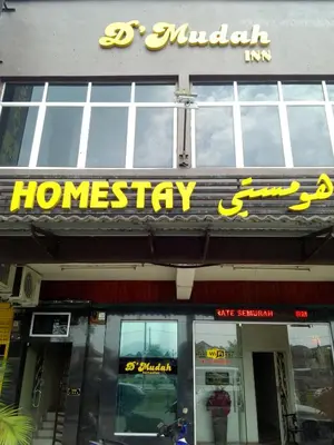 a store front with a sign for a home pharmacy at D'Mudah Motel & Homestay in Kulim