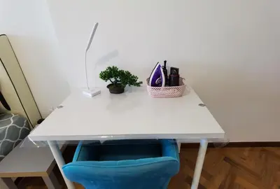 a white desk with a blue chair next to it at LM HomeyA 3 BdRm Coastline View condo for 4-14 Pax with Netflix & Coway Water Purifier in Tanjong Tokong