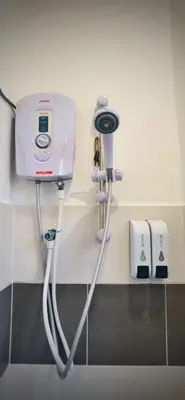 a hospital room with a hair dryer on a wall at [Muji-Style Apartment] @ Cameron Jaya (3R2B) 8 pax in Tanah Rata