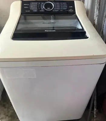 a white stove top oven in a kitchen at Homestay Salak 756 at Sungai Siput Kuala Kangsar for Islamic Guest Only in Sungai Siput