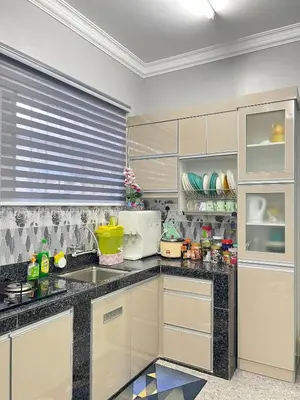 a kitchen with a sink and a counter top at Homestay Salak 756 at Sungai Siput Kuala Kangsar for Islamic Guest Only in Sungai Siput
