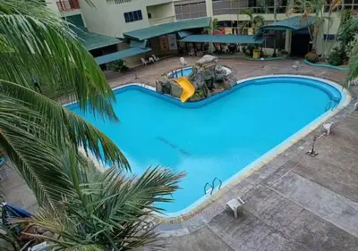 an overhead view of a large blue swimming pool at CORAL BAY APARTMENT 3room (Ocean apartment) in Pangkor