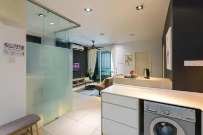 a kitchen and living room with a washing machine at 2R1B/Seaview Garden/1~8pax/Gurney/Mansion One in George Town