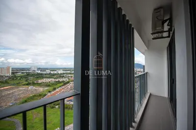 a balcony of a building with a view of a city at De Luma - Meritus in Perai