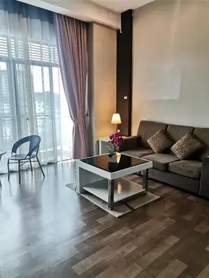 a living room with a couch and a coffee table at Dzulstudio(Muslim) Nova Highland in Brinchang