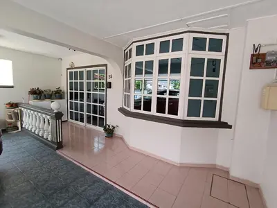 a living room with two windows and a tile floor at Grey Fantasy Homes#Sunway Water Theme Park in Ipoh