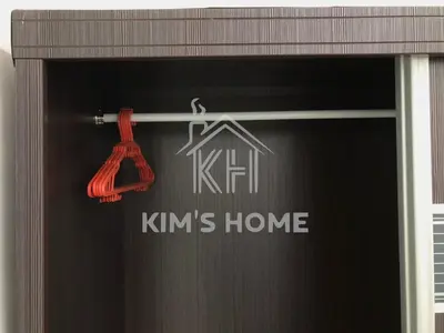 a sign on a window with a house on it at Kim’s Home - Homey At Your Stay in Nibung Tebal