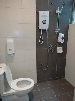 a bathroom with a toilet and a shower at The Gallery Camerons, cosy for the whole family in Brinchang