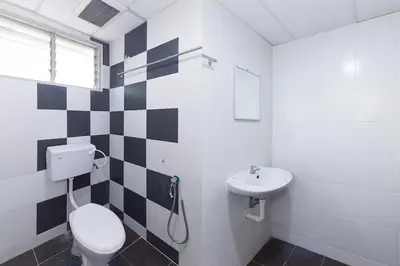 a bathroom with a toilet and a sink at Silibin Times Inn Hotel in Ipoh