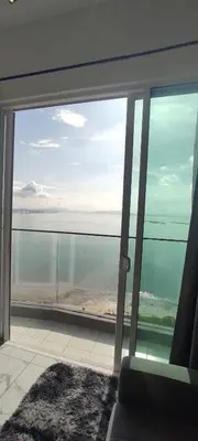 a view of the ocean from a room with a window at Infinite Seaview with Penang Bridge Suite with Sunrise up to 11 person in Bayan Lepas