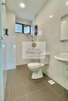 a bathroom with a toilet and a sink at A' Casa Homestay Ipoh Perak in Ipoh