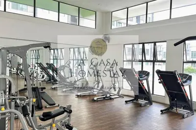 a gym with a bunch of treadmills and machines at A' Casa Homestay Ipoh Perak in Ipoh