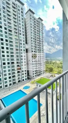 a balcony with a view of two tall buildings at A' Casa Homestay Ipoh Perak in Ipoh