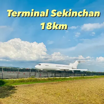 an airplane is sitting on the runway at an airport at AISY HOMESTAY - Rumah 4 atau 5 in Kampong Tanjong Karang