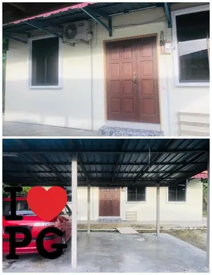 a house with a red door and a red heart at Homestay D'Art Container in Balik Pulau